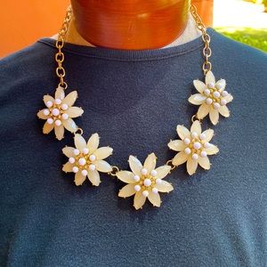 Pretty little floral statement necklace of light purple and white.